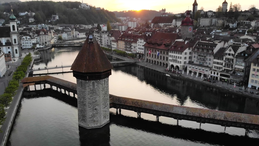 Aerial view of Lucerne, Switzerland at sunset while crossing Kappelbrücke bridge towards Altstadt Royalty-Free Stock Footage #1074187904