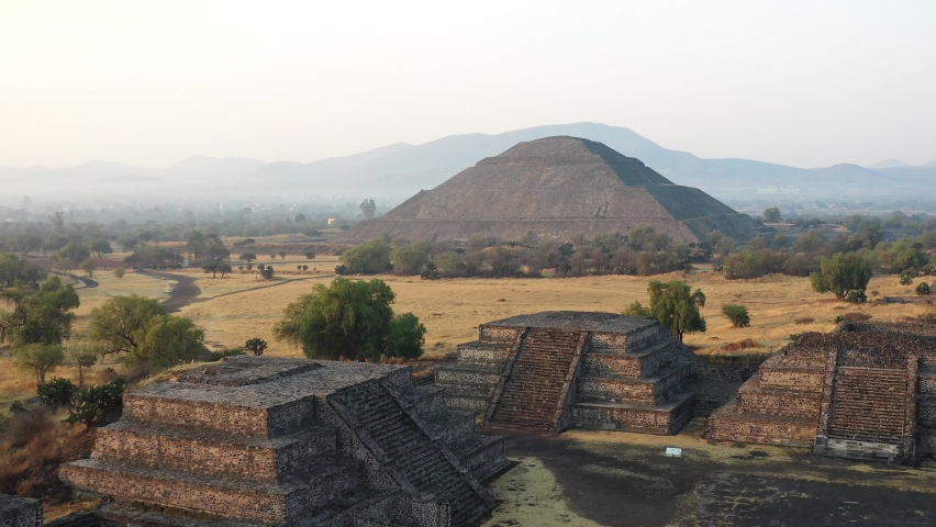 Aerial view of pyramids in ancient mesoamerican city of Teotihuacan, Mexico from above, Central America, sunrise, 4k