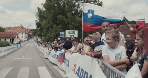 NOVO MESTO, SLOVENIA - JUNE 13 2021: Cycling fans cheering at Tour