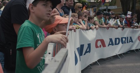NOVO MESTO, SLOVENIA - JUNE 13 2021: Cycling fans cheering at Tour