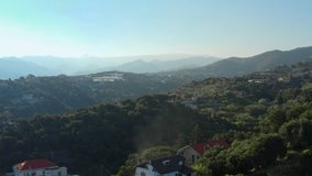 Aerial view of landscape in Garbasso, Celle Ligure comune, Savona province, regione Liguria region. Ligurian coastline with green hills. Drone 4k footage