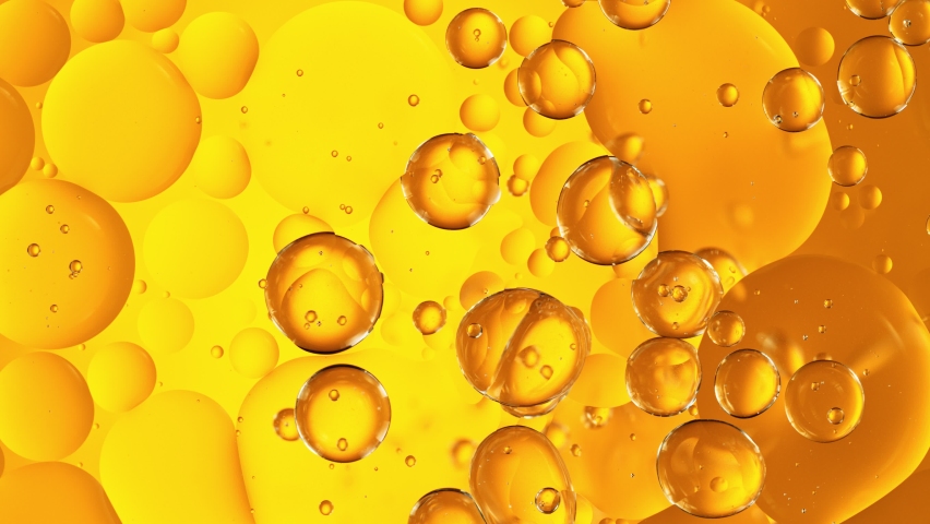 Super Slow Motion Shot of Moving Oil Bubbles on Golden Background at 1000fps. Royalty-Free Stock Footage #1074202412