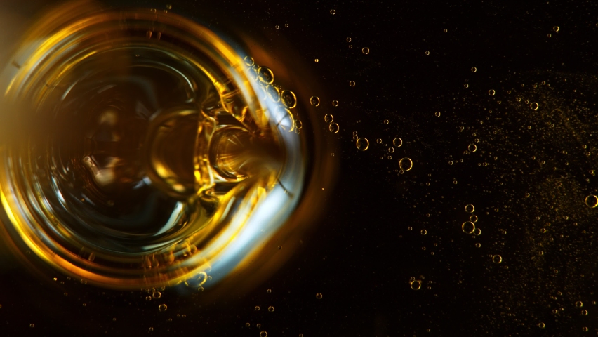 Super Slow Motion Shot of Pouring Oil Isolated on Black Background at 1000fps. Royalty-Free Stock Footage #1074202430