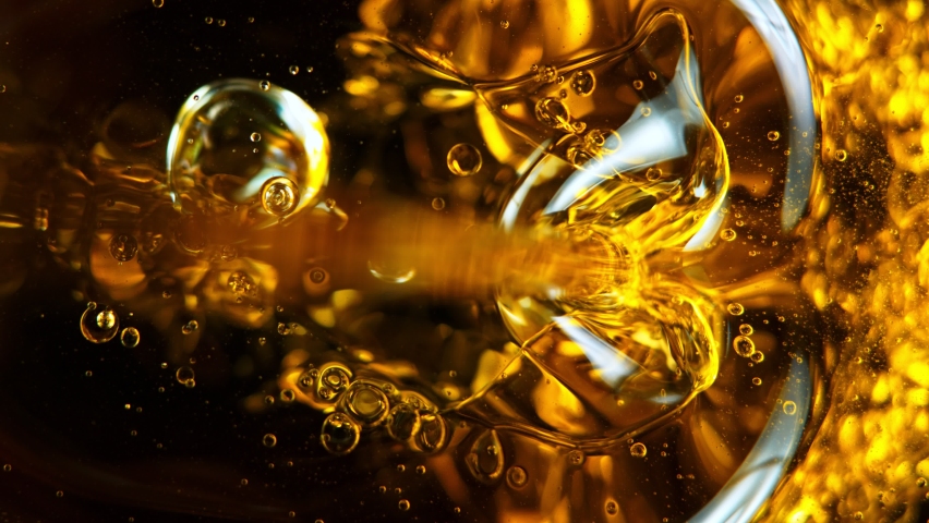 Super Slow Motion Shot of Pouring Oil Isolated on Black Background at 1000fps. Royalty-Free Stock Footage #1074202430