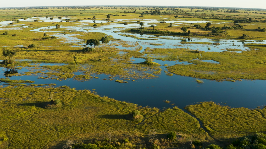 Aerial fly over view of the beautiful scenic waterways and lagoons of the Okavango Delta Royalty-Free Stock Footage #1074203642