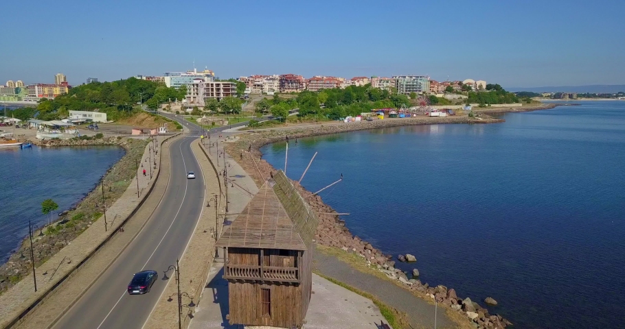 Aerial drone view of Old windmill and The road connecting the New and Old town of Nessebar in Bulgaria