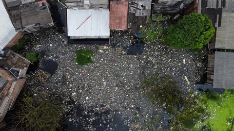 Aerial view of high quantities of trash  inside a canal near Negro River, downtown Manaus, located in Amazonas state, Brazil.