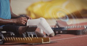 Animation of digital data processing over disabled male athlete putting running blades on. global sports, competition, disability and digital interface concept digitally generated video.