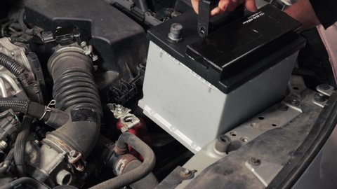 Replacing dead starter battery in a car, installing new one for reliable operation