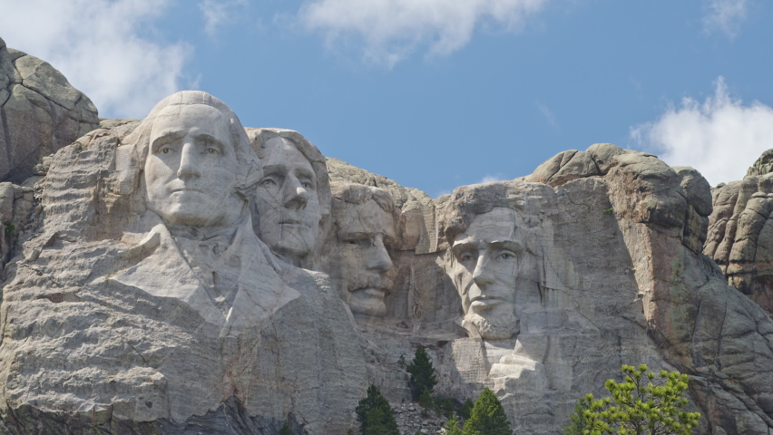 Clouds moving over Mount Rushmore on sunny day in at the monument.