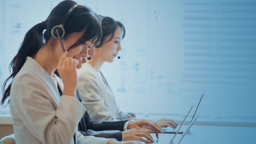 Group of operator working in the office and communication network concept. Customer service. Call center. Royalty-Free Stock Footage #1074222707
