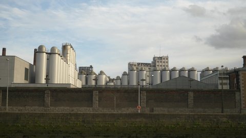 Dublin , Ireland - 05 10 2021: Guinness Brewery Plant Located Near Liffey River. static shot 