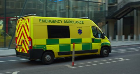 London , United Kingdom (UK) - 04 19 2020: England NHS emergency ambulance driving through empty streets in Covid pandemic lockdown