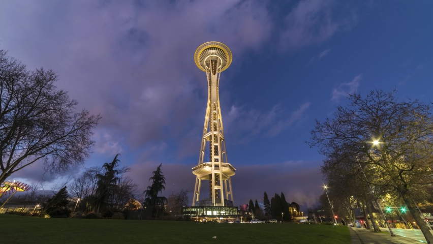 SEATTLE, USA - FEBRUARY 4, 2021: Seattle Space Needle Tower at Sunset. Day to Night Time Lapse.