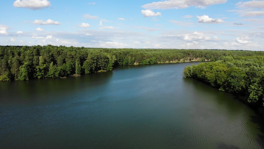 Aerial view. Lake and green forest in Tuchola National Park, Poland. Summer landscape in Europe. Perfect place for relaxing in nature.