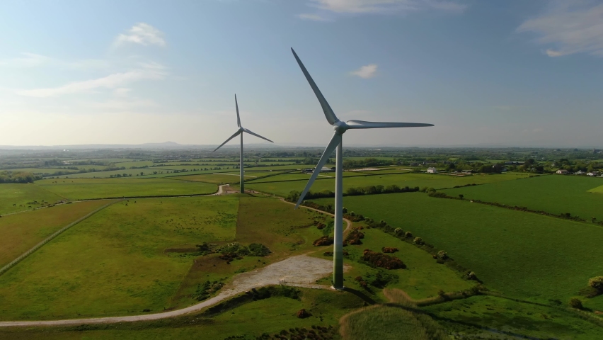 An aerial rotation of Ballywater Wind Farm in County Wexford. | Shutterstock HD Video #1074261254