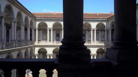 The courtyard of the Pinacoteca di Brera University with a statue of Napoleon. Statues and columns. Italian architecture. Art is an empty city without students and tourists. Milan, Italy, June 2021 