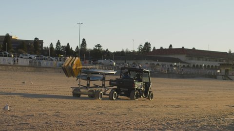 SYDNEY, NSW, AUSTRALIA, JUNE 11 2021. Lifeguard vehicle on empty Bondi beach slow motion.