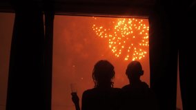 Boy and girl hug and look at the fireworks on - Powered by Shutterstock - Get 15% off with code: PIKWIZARD15