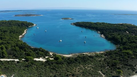 Picturesque View Of Croatian Beach With Yachts At Cape Kamenjak National Park Near Pula In Istria, Croatia. - Aerial Drone Shot