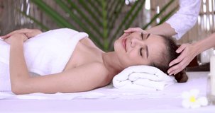 Beautiful young asian woman relaxing in spa salon footage video 4k 