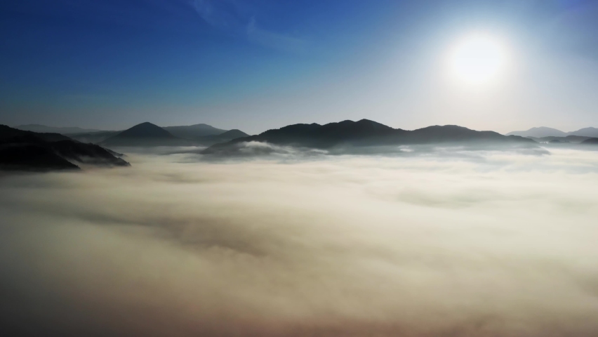 Flying over misty forest and sea of clouds, forest breathing, importance of the forests green concept slow motion 4k 60p | Shutterstock HD Video #1074298100
