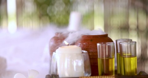  oil treatments in spa resort with candle and dry ice smoke blur bokeh background 4k resolution 