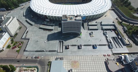 Warsaw , Poland - 08 25 2018: Revealing View Of Kiev Olympiyskiy Stadium. Tilt Up. Aerial City Panorama - 08 25 2018: Kiev, Ukraine