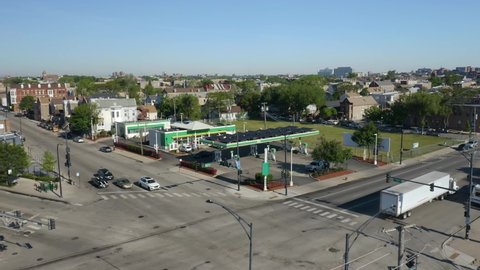 Chicago , Illinois , United States - 05 30 2021: Aerial Establishing Shot of BP (British Petroleum) Gas Station in Urban Neighborhood during Daytime.