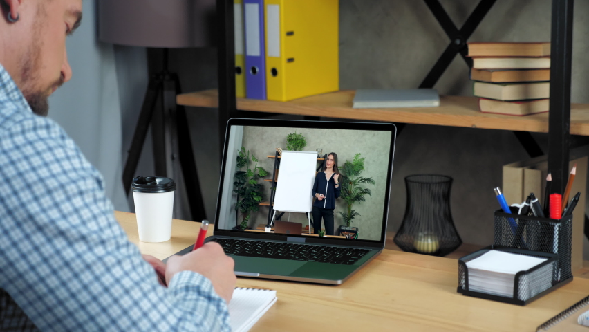 Businessman in office writes in notebook study listen business coach online video call webcam chat. Woman teacher tutor near whiteboard in laptop computer screen tells teaches student remote webinar  - Powered by Shutterstock - Get 15% off with code: PIKWIZARD15