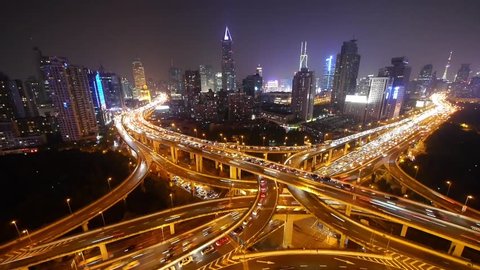timelapse,Aerial View freeway city rush hour heavy traffic jam highway,shanghai Yan'an East Road Overpass interchange,driving racing by with streaking lights trail, super long exposures. gh2_07486