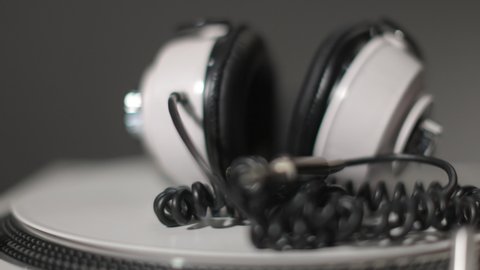 Close up view of a record player with headphones rotating