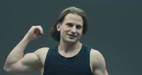 Cool young guy with long hairs let his hair down. Handsome athletic male smiling. Alopecia treatment advertising video