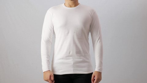 Blank long sleeved shirt mock up template, front view, Asian man wear plain white t-shirt isolated on white. Tee design mockup presentation for print