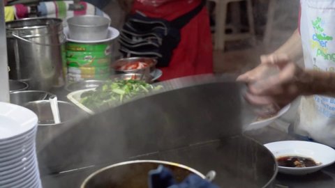 George Town , Penang , Malaysia - 01 12 2020: Asia Street Food Man Cooking Wanton Noodle Chulia Penang