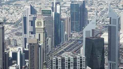 Dubai , United Arab Emirates - 01 30 2021: Worlds most famous intersection and skyline seen from Burj Khalifa in Dubai, sunny cityscape in United Arab Emirates, Sheikh Zayed road