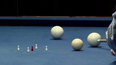 A Man playing Five-pin Billiards, Bowling Pins and Balls in Buenos Aires, Argentina. Close Up. 