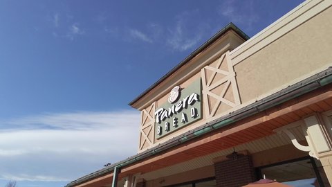 Westminster , CO , United States - 01 03 2021: Panning view of Panera Bread exterior storefront