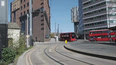 London , County , United Kingdom (UK) - 05 05 2021: London tram surrounded by traffic in croydon