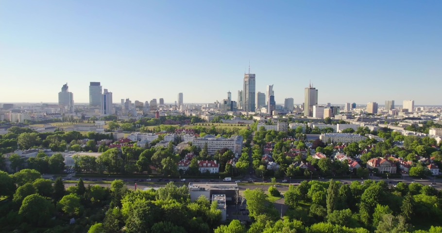 Pole Mokotowskie Warsaw Park field with lake and city skyscrapers in the background. Aerial view of the city park with green trees. Summer season. Royalty-Free Stock Footage #1074376469