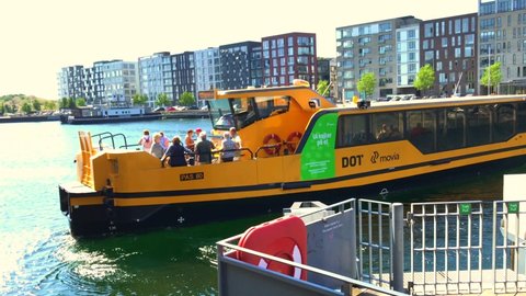 Fully electric water bus ferries are reducing the CO2 pollution from public transportation via utilisation of innovative environmentally friendly technology. Copenhagen, Denmark - June 17, 2021