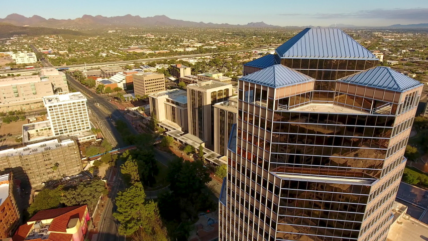 Cinematic rotating drone shot of downtown Tucson Arizona and surrounding city buildings