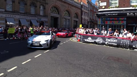 London , United Kingdom (UK) - 08 04 2018: Celebrities driving with expensive racings cars through roads of London. Gumball 3000 Event in summer. Tracking shot.