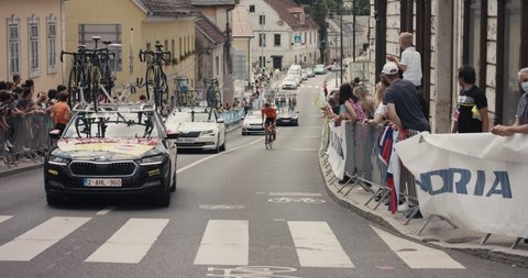 NOVO MESTO, SLOVENIA - JUNE 13 2021: Team cars ride at cycling Tour