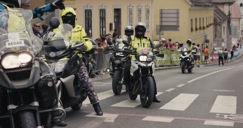 NOVO MESTO, SLOVENIA - JUNE 13 2021: Motorcyclists security at Tour