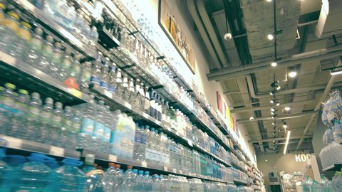 MOSCOW, RUSSIA - MAY 26, 2021. Plastic bottles of water on the shelves of a supermarket