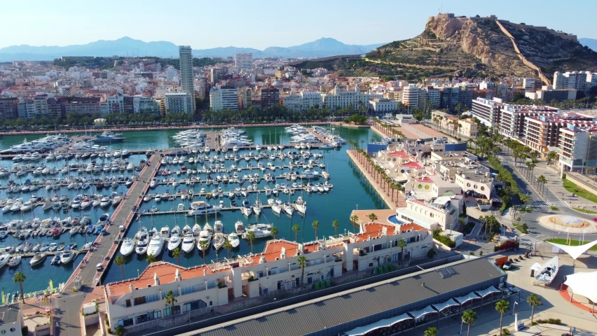 Boats And Luxury Yachts Moored At Marina Of The Port Of Alicante In Spain. aerial