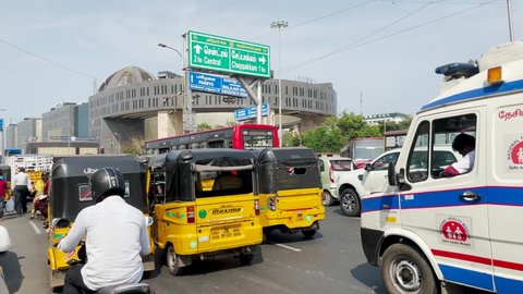 Chennai , Tamil Nadu , India - 04 09 2021: Tuk-tuk Vehicles On The Road Passing By Tamil Nadu Government Multi Super Speciality Hospital