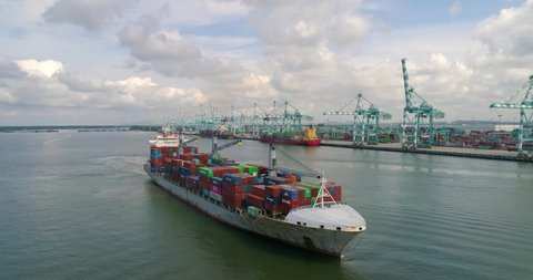 Aerial shot 4K container ship leaving  port tanjung pelepas - Tanjung pelepas Johor bahru, Malaysia 2020