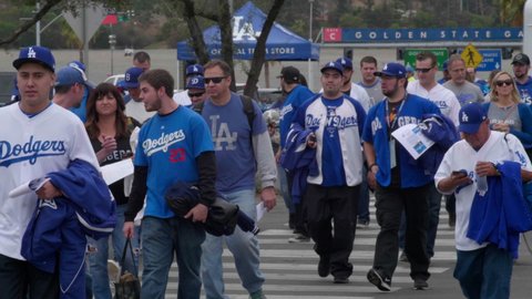 Los Angeles , CA , United States - 05 11 2021: Los Angeles Dodgers fans entering Dodger stadium to watch the Baseball game